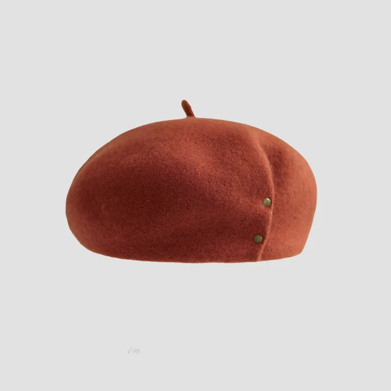 Rust-colored wool beret with two buttons.