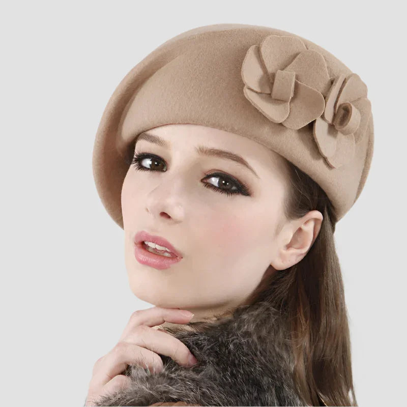 Tan wool beret with flower embellishments.