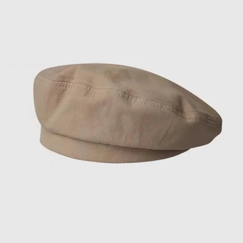 Beige beret hat.