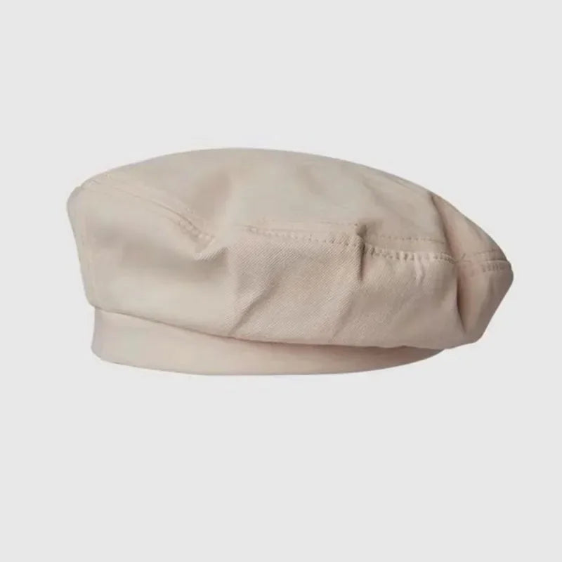 Beige beret hat.