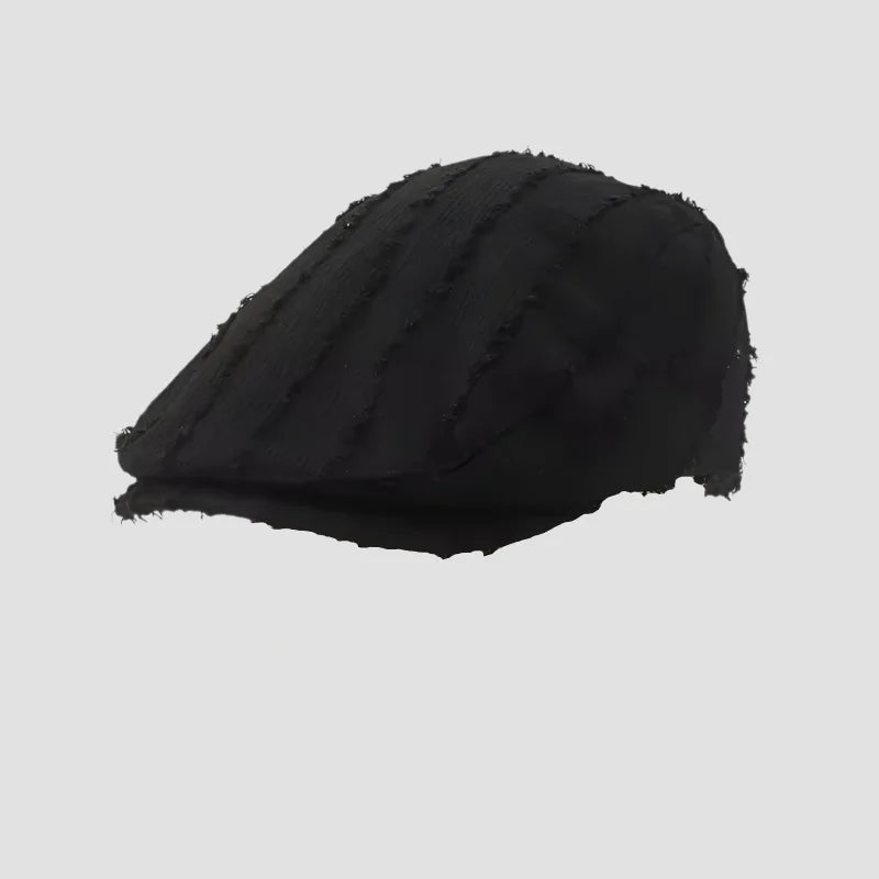 Black newsboy cap.