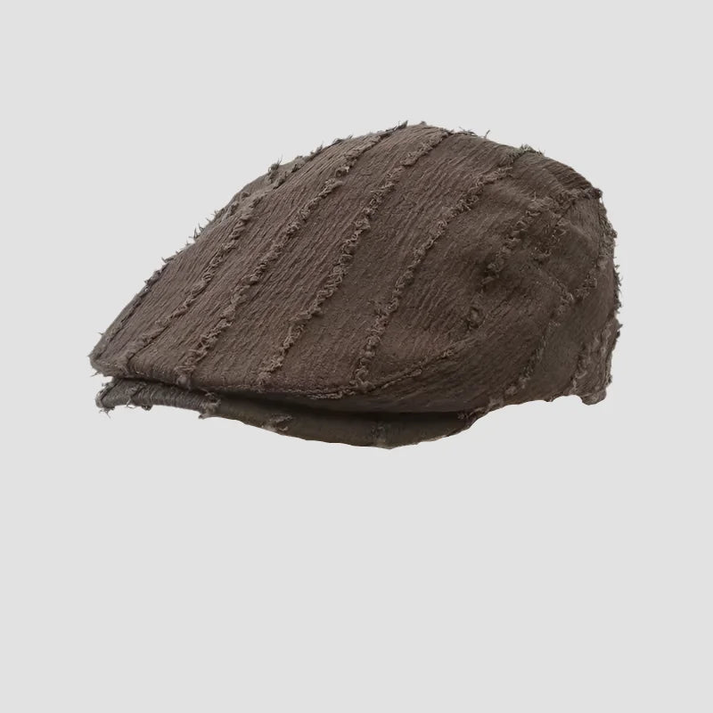 Brown textured flat cap.