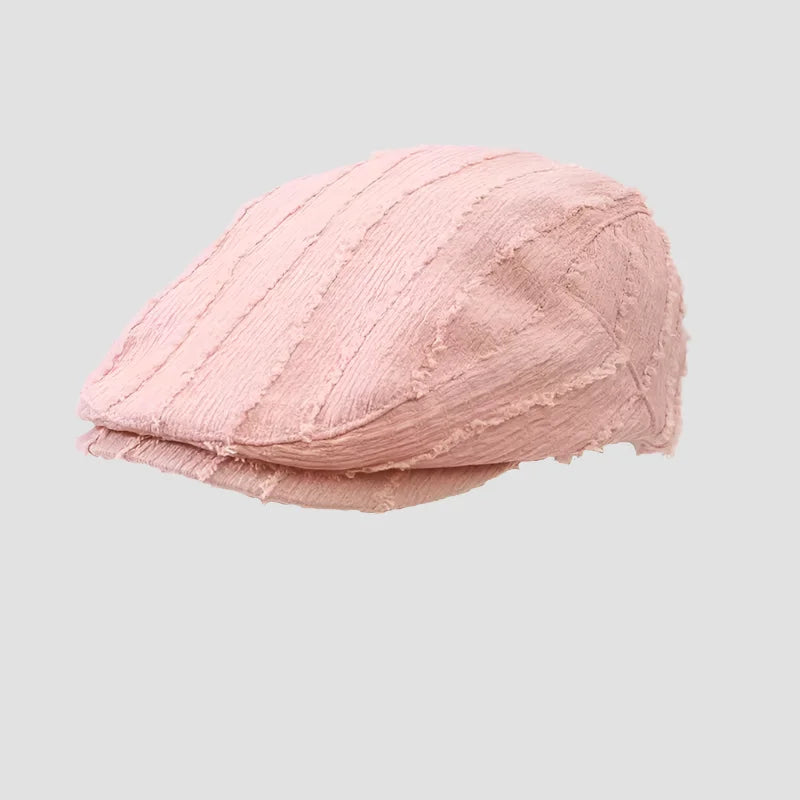 Pink textured flat cap.