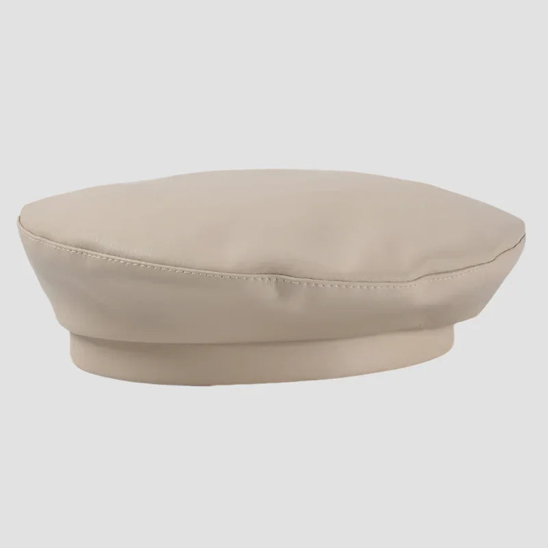 Beige faux leather beret.