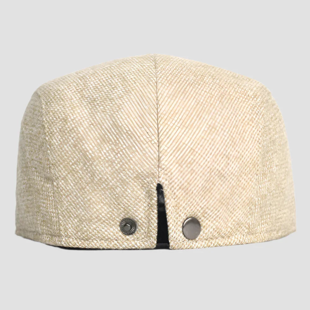 Beige herringbone flat cap.