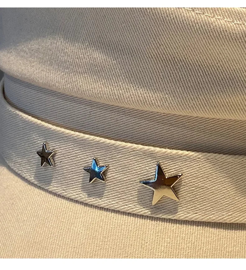 Beige hat with star embellishments.