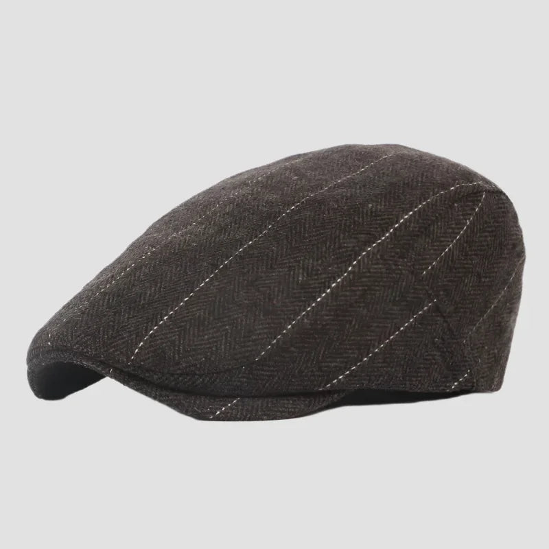 Brown herringbone flat cap.