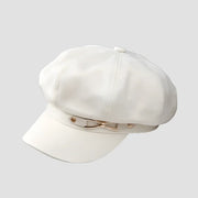 White baker boy hat with gold accents.