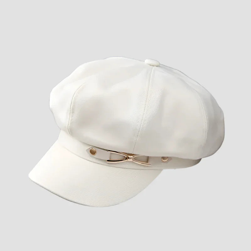 White baker boy hat with gold accents.