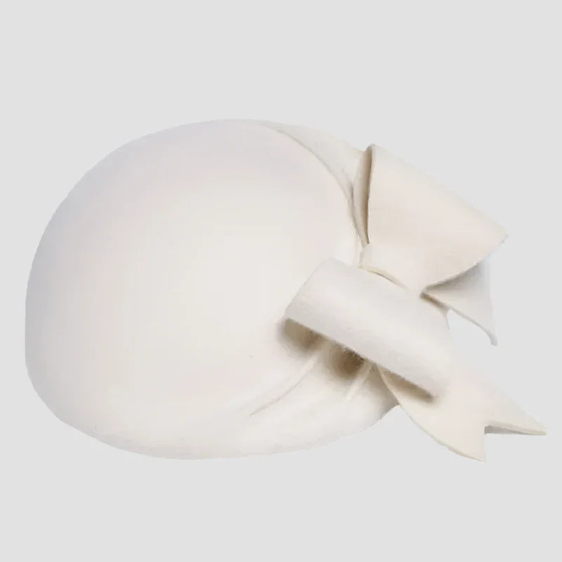 Cream-colored hat with bow.