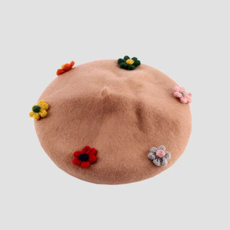 Beige beret with colorful crocheted flowers.