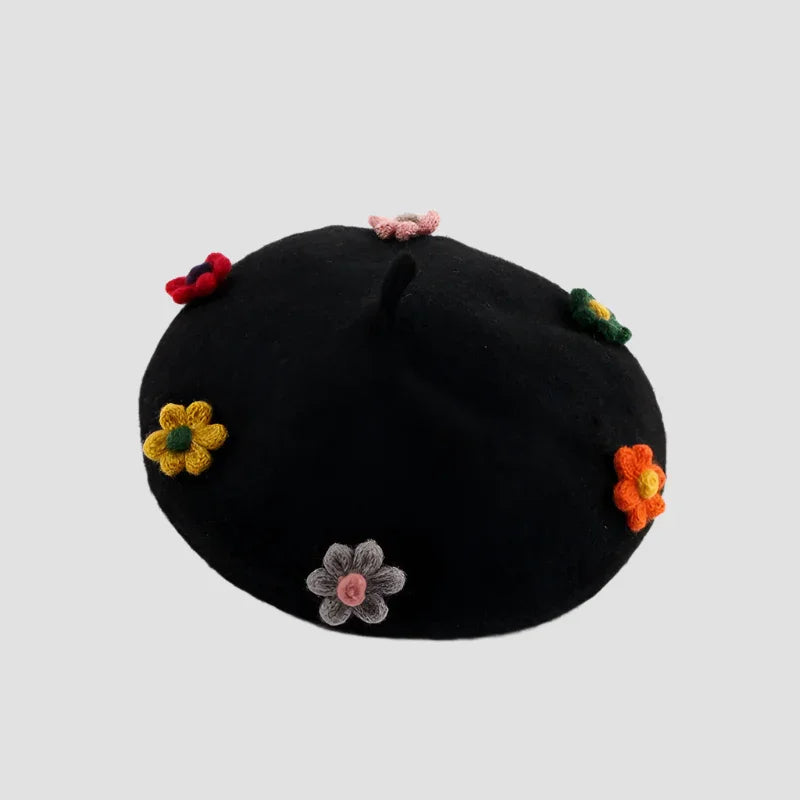 Black beret with colorful crocheted flowers.
