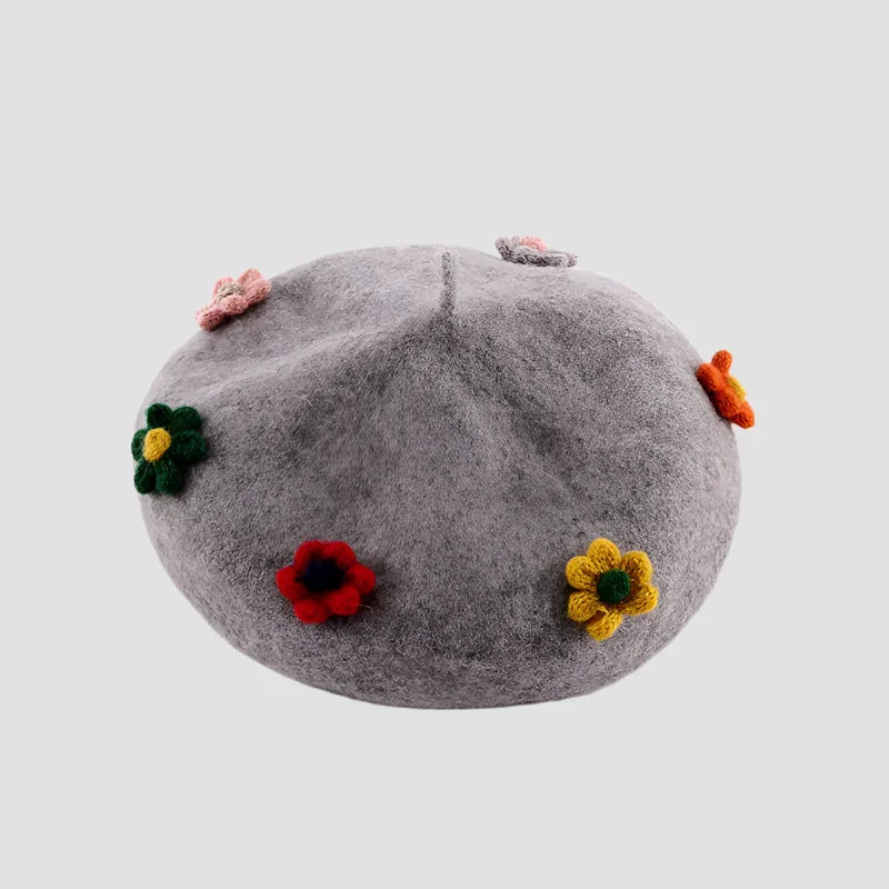 Gray beret with colorful flower embellishments.