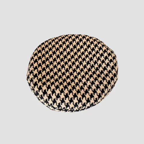 Houndstooth patterned beret.