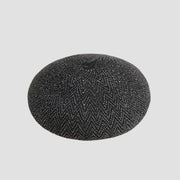 Black and white patterned beret.