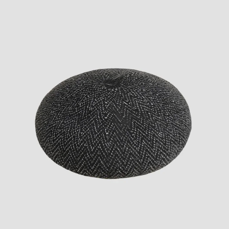 Black and white patterned beret.