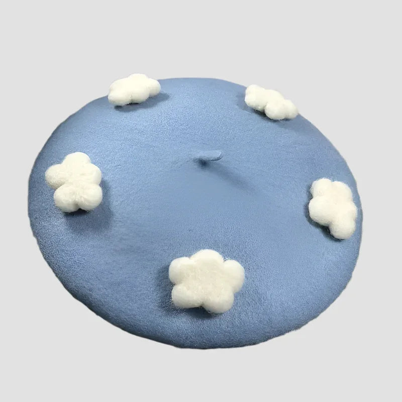 Blue beret with white cloud accents.
