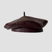 Burgundy leather beret.