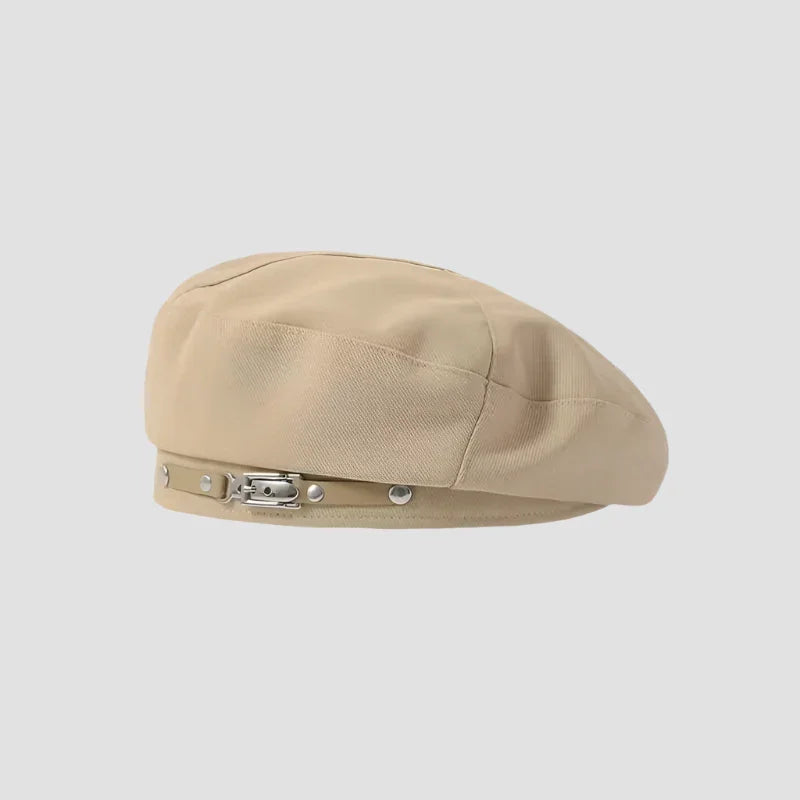 Beige beret with buckle detail.
