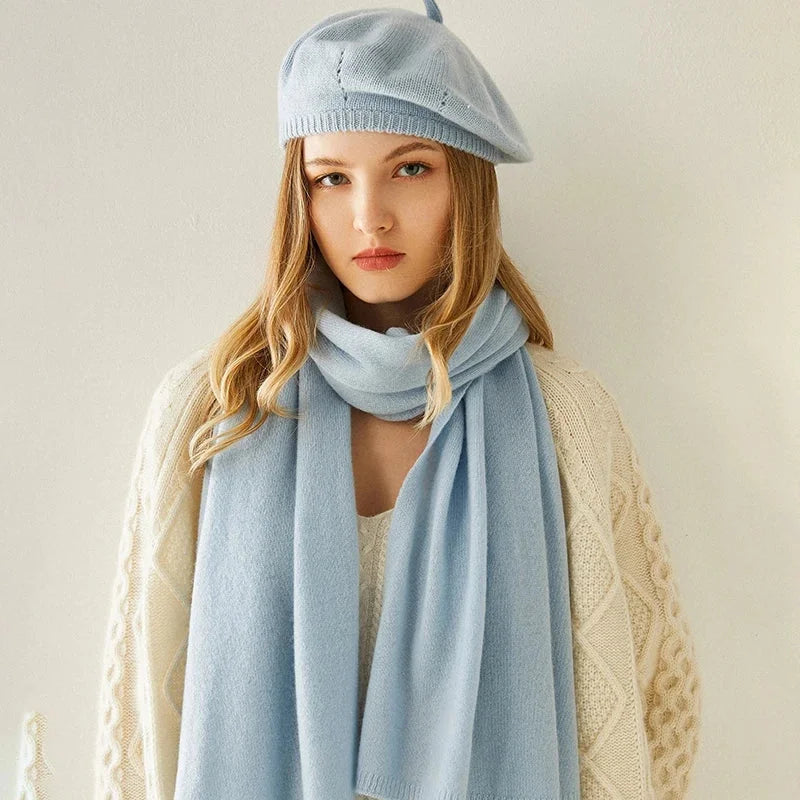 Light blue knitted beret and scarf set.
