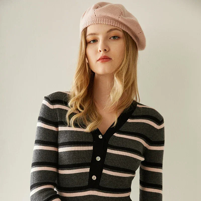 Striped knit cardigan with a pink beret.