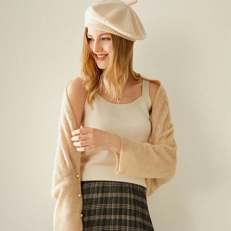 Woman in beret and cardigan.