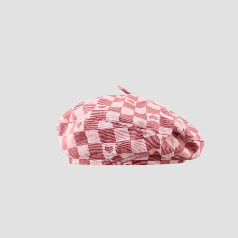 Pink checkered beret with hearts.
