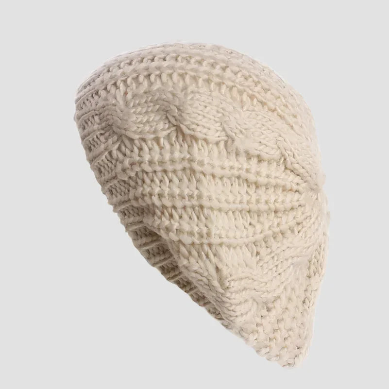 Cream-colored knitted beret.