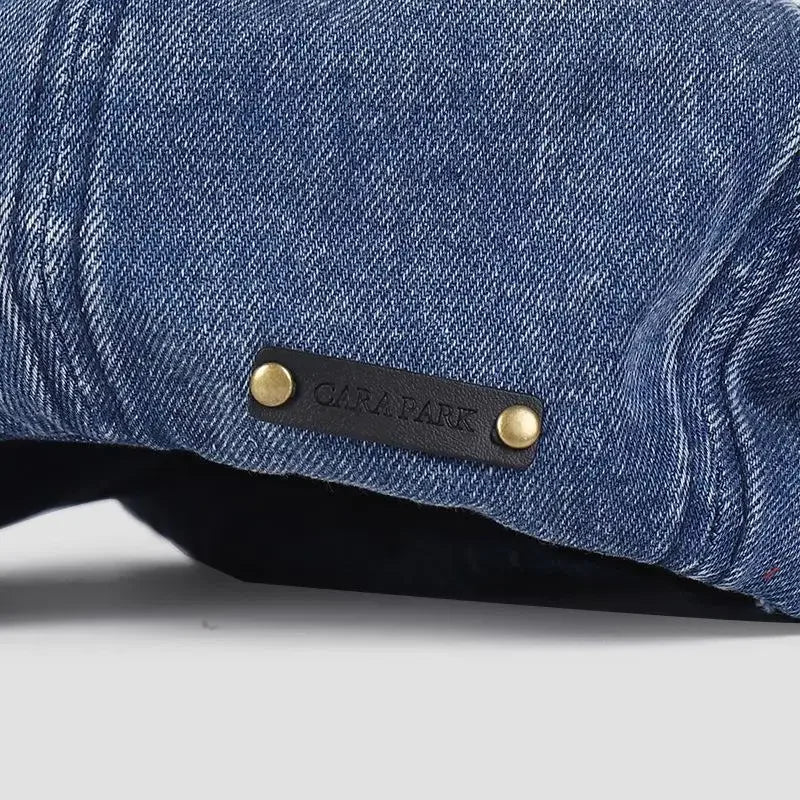 Blue denim cap with leather label.