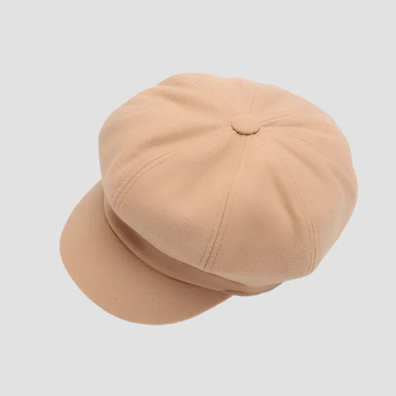 Beige newsboy cap.