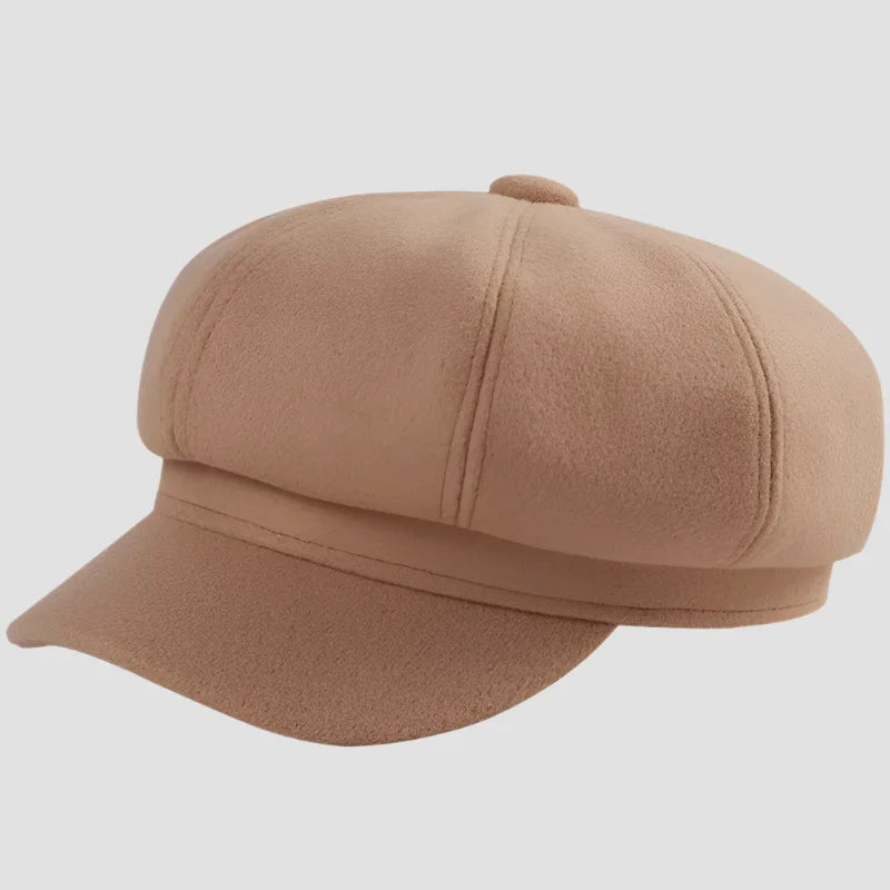 Tan baker boy hat.