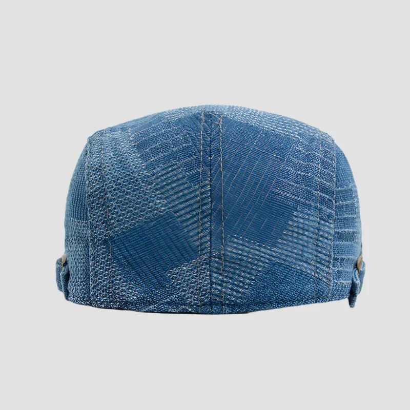 Blue patterned flat cap.
