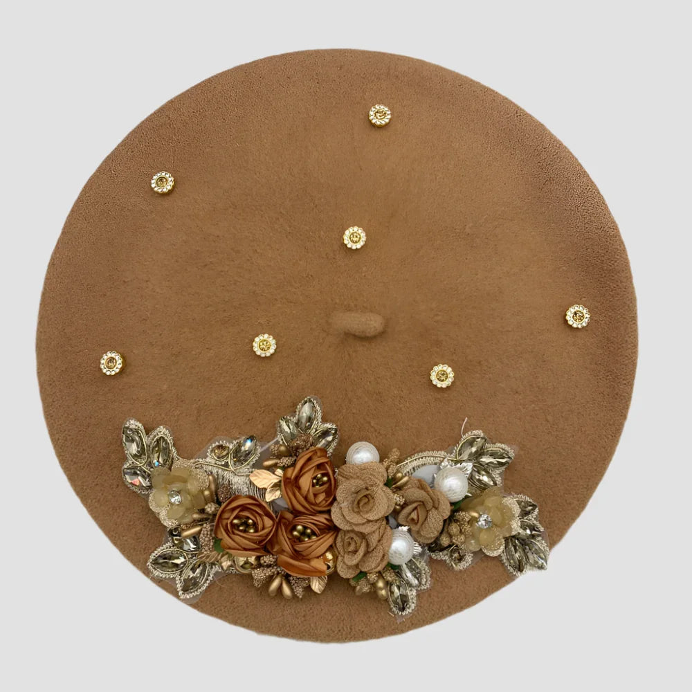 Brown beret with floral embellishments.