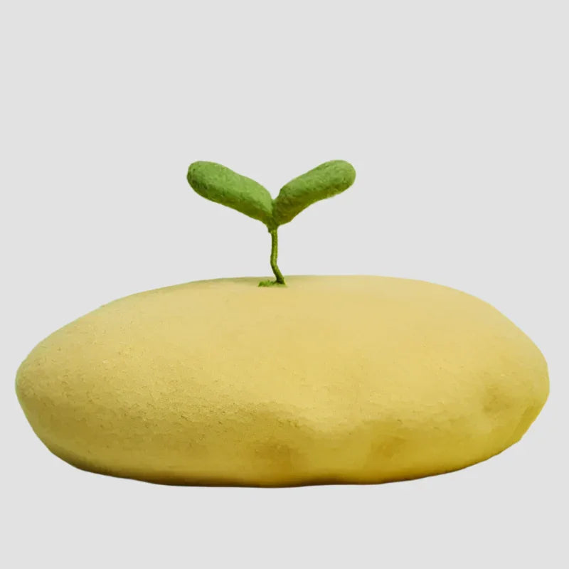 Yellow beret with sprout.