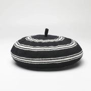 Black and white striped beret.