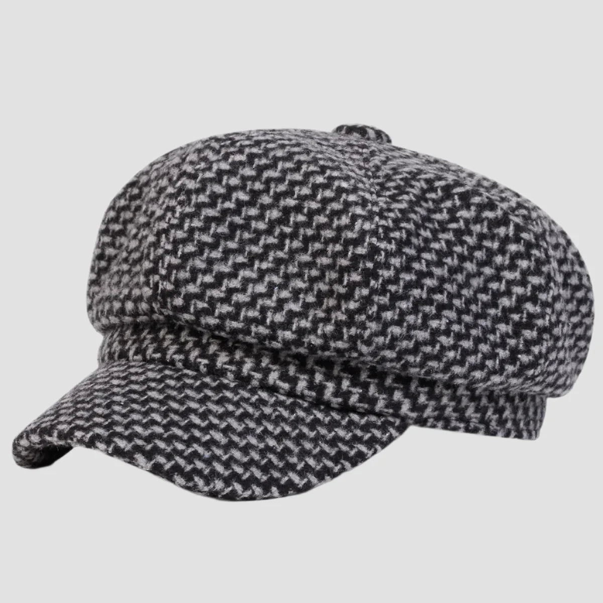 Black and white herringbone newsboy cap.