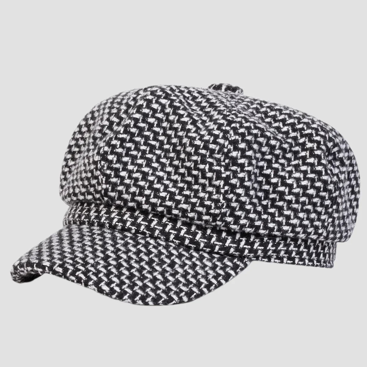 Black and white patterned newsboy cap.