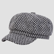 Black and white patterned newsboy cap.