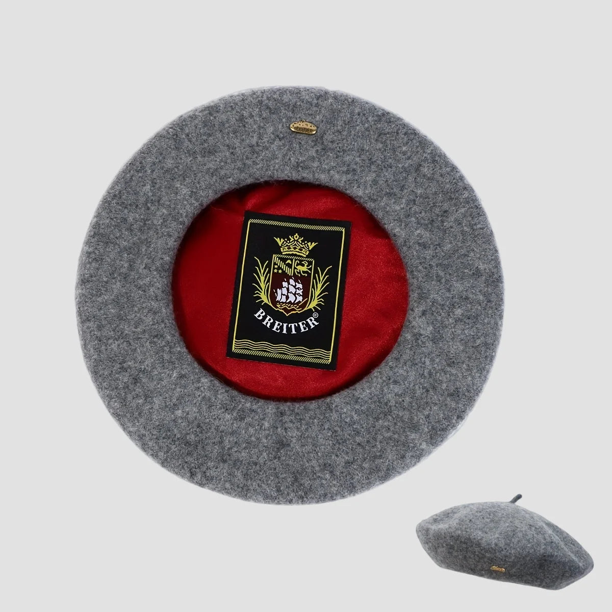 Gray beret with red interior and Breiter logo on a light gray background