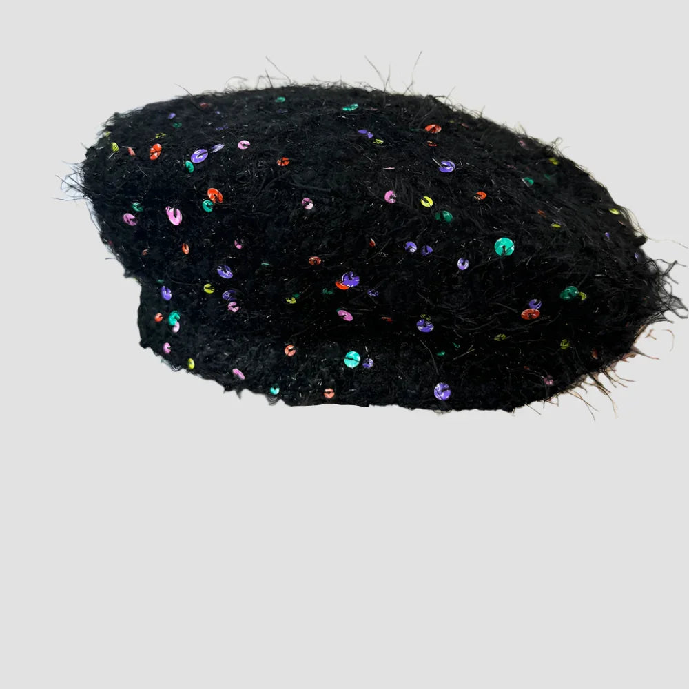 Black fuzzy beret with colorful sequins.