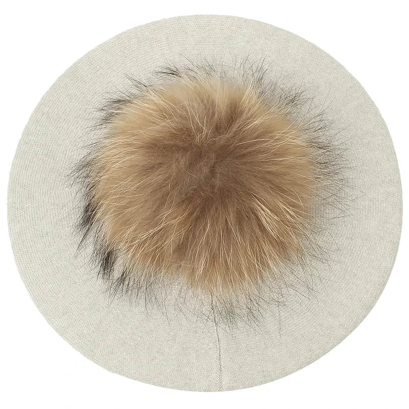 Beige beret with fur pompom.