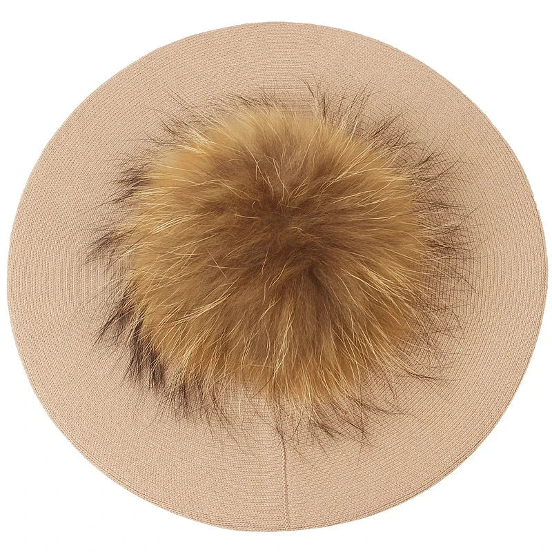 Beige beret with fur pompom.