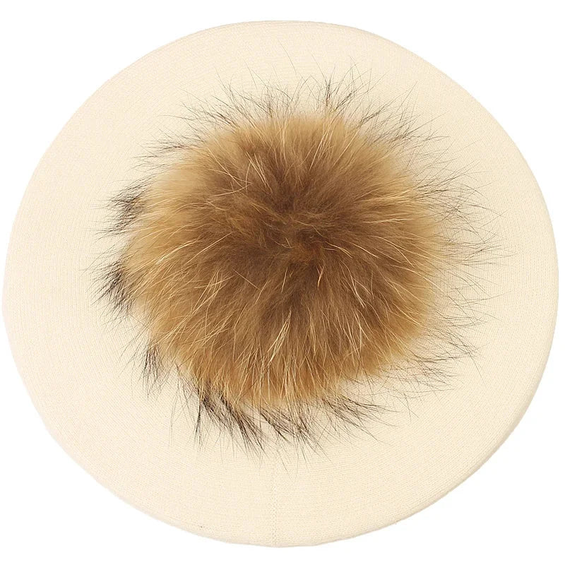 Cream beret with fur pompom.