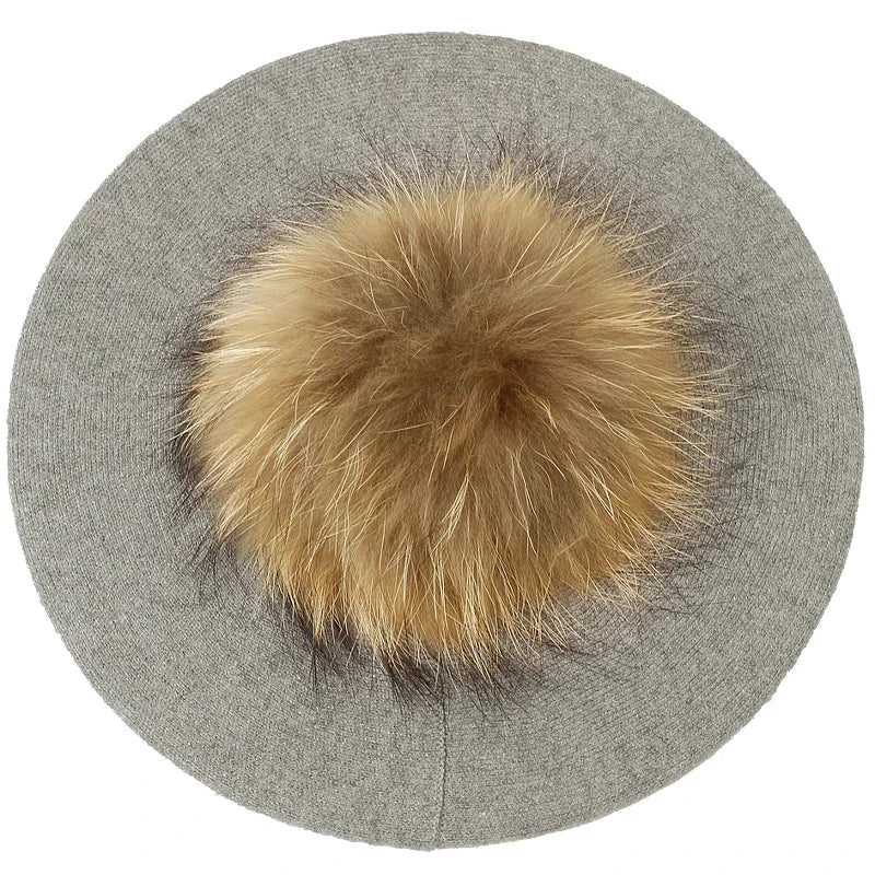 Gray beret with fur pompom.
