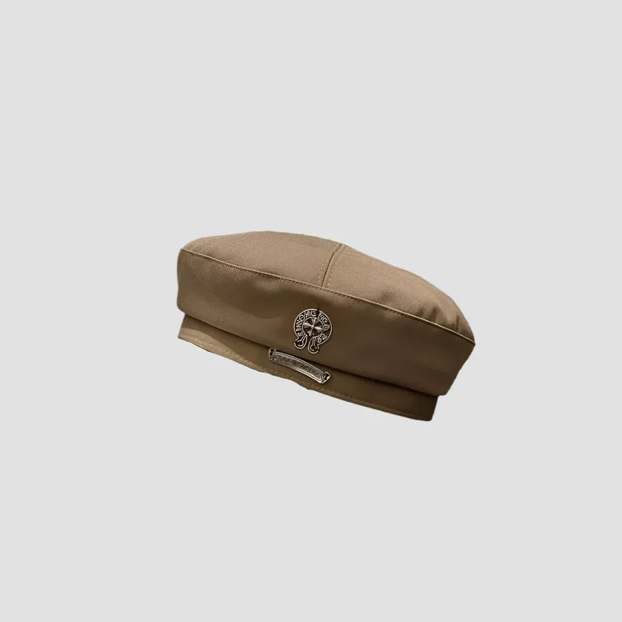 Beige beret with silver embellishments.