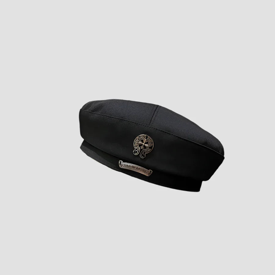 Black beret with silver embellishments.
