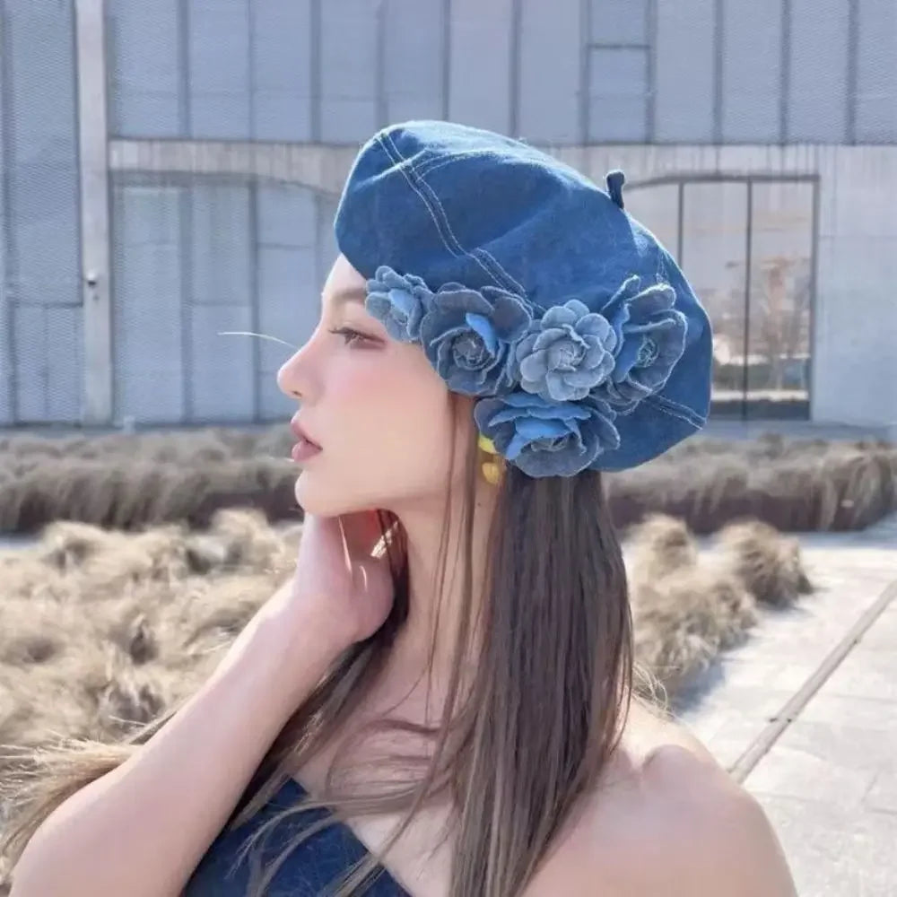 Denim beret with floral embellishments.