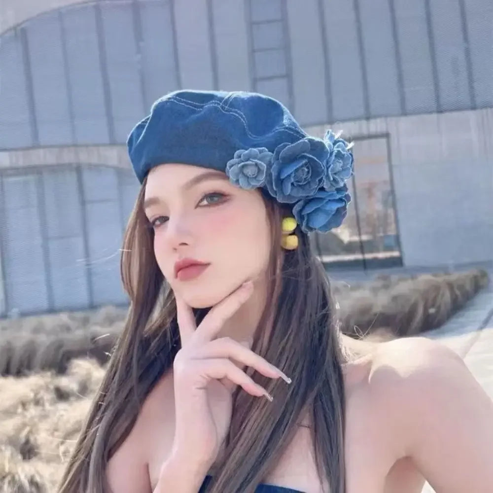 Denim beret with floral embellishments.