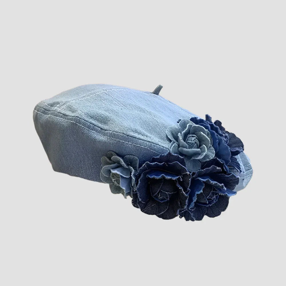 Denim beret with floral embellishments.