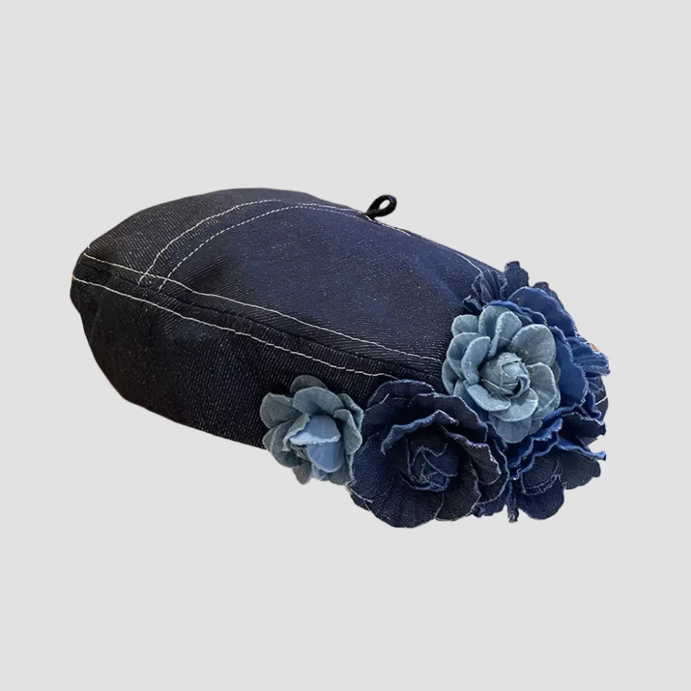 Denim beret with floral embellishments.